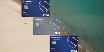 a group of credit cards on a beach