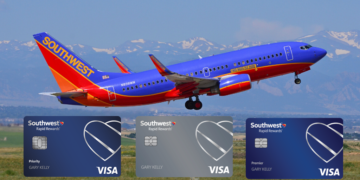 a plane flying over a field with credit cards