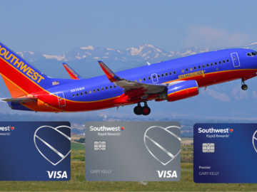 a plane flying over a field with credit cards
