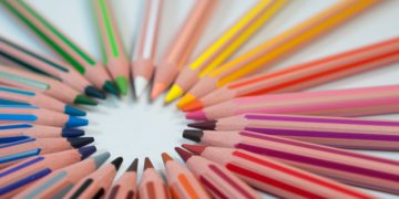 a group of colored pencils arranged in a circle