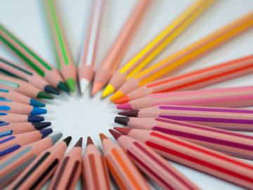a group of colored pencils arranged in a circle