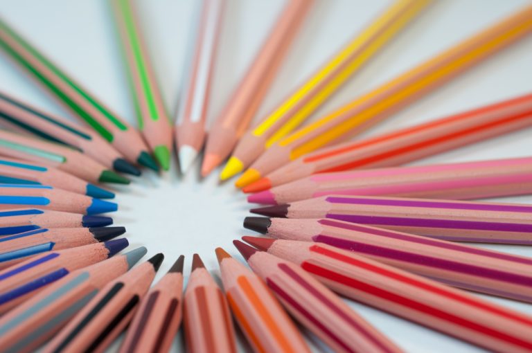 a group of colored pencils arranged in a circle