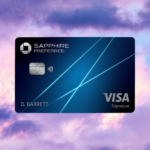 a blue credit card with blue lines and a pink and purple sky