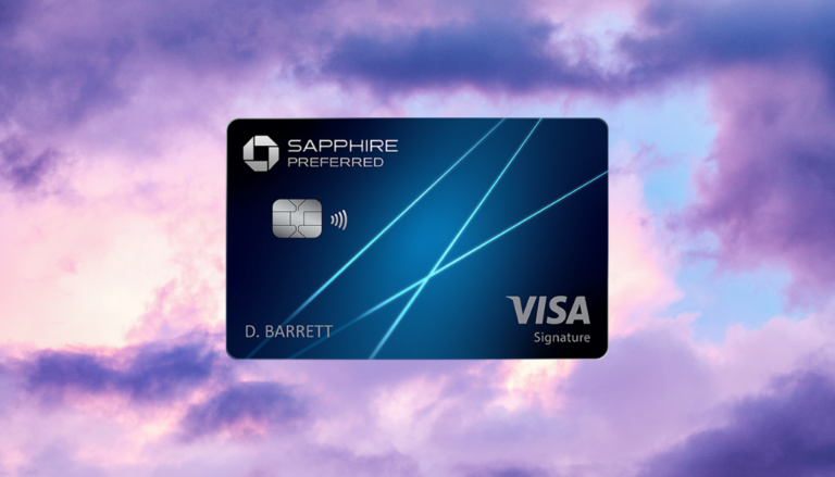 a blue credit card with blue lines and a pink and purple sky